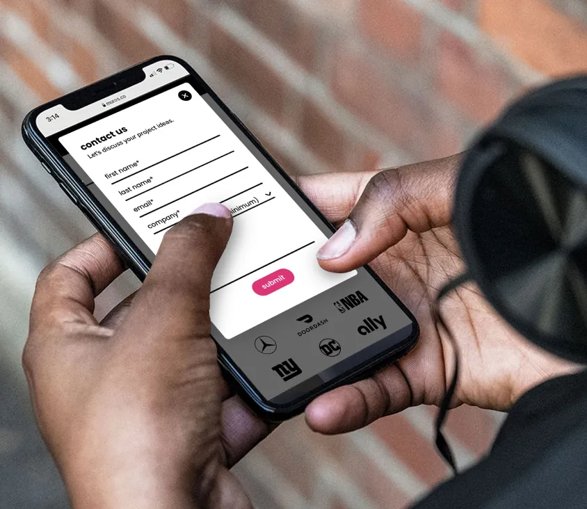 hands holding a cell phone about to tap on a contact form